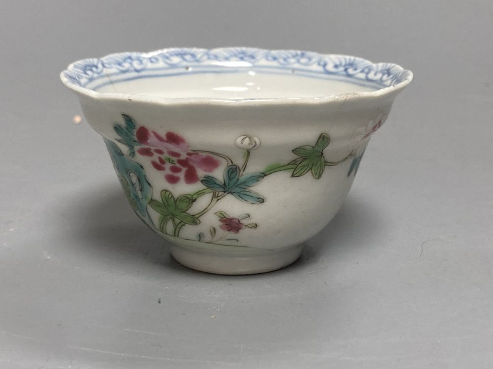 An 18th century English blue and white tea bowl and three smaller Chinese ceramic cups, two marks